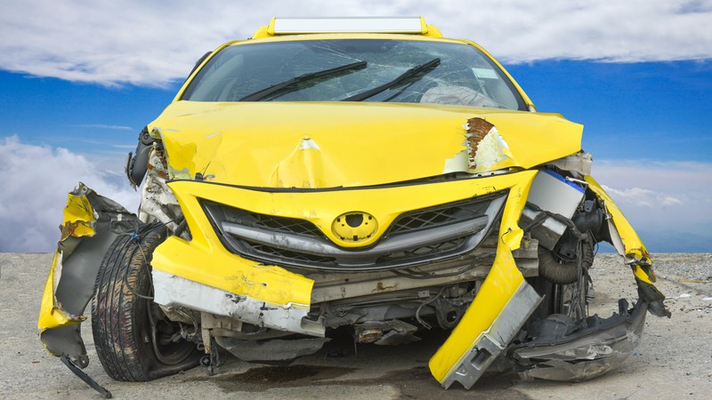 Crushed Yellow Car Before Professional Auto Body Repair